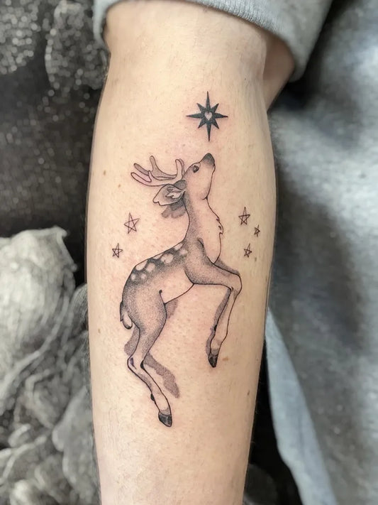 Small Fine Line Deer and Stars Tattoo on Women Forearm by @narthangel_tattoo