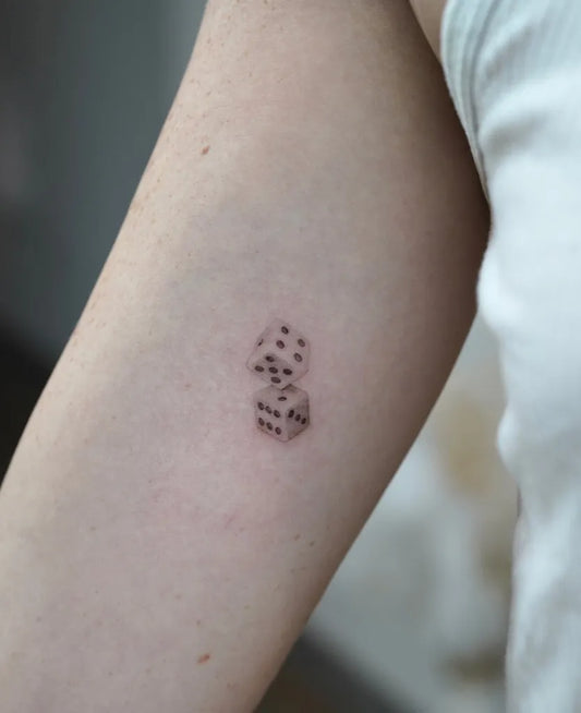 Small Fine Line Dice Tattoo on Women Arm by @tattooartbyhailey