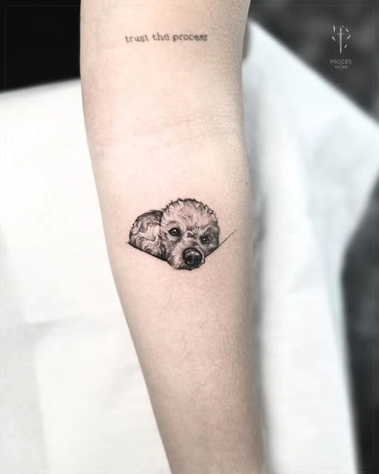 Small Fine Line Dog Tattoo on Women Arm by @procer.tattoo.studio