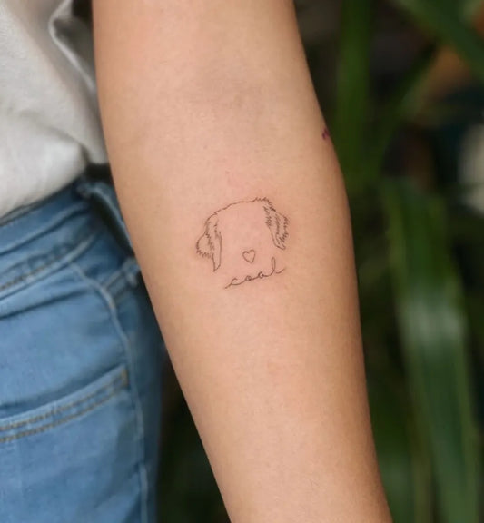 Small Fine Line Dog Tattoo on Women Arm by @tatsbynikko