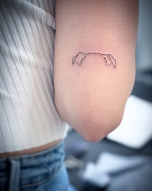 Small Fine Line Dog Tattoo on Women Arm by @wake_up_in_makeup