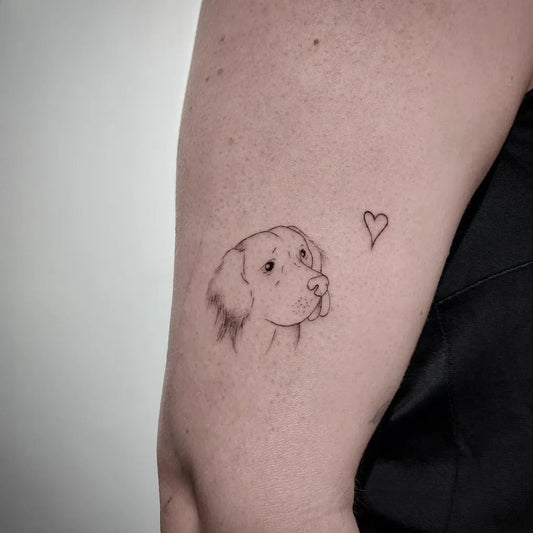 Small Fine Line Dog and Heart Tattoo on Women Arm by @paultje.tattoo
