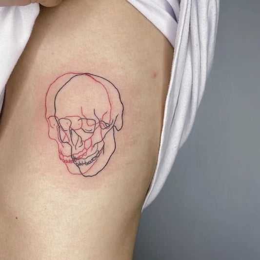 Small Fine Line Double Skull Tattoo on Women Arm by @wildtattoo_art