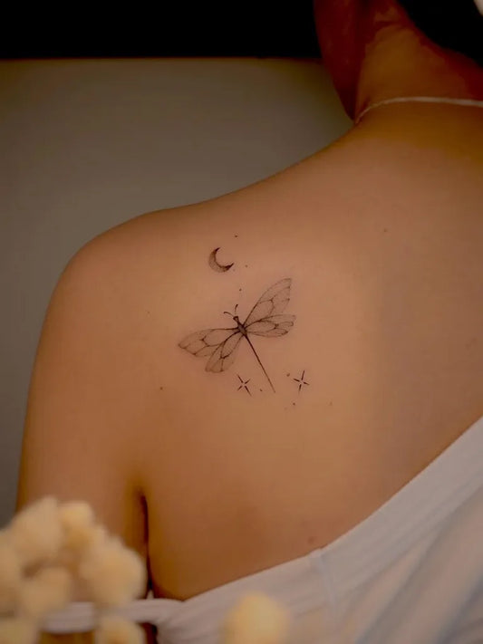 Small Fine Line Dragonfly with Crescent Moon and Stars on Women Shoulder Tattoo by @zoe.fineline