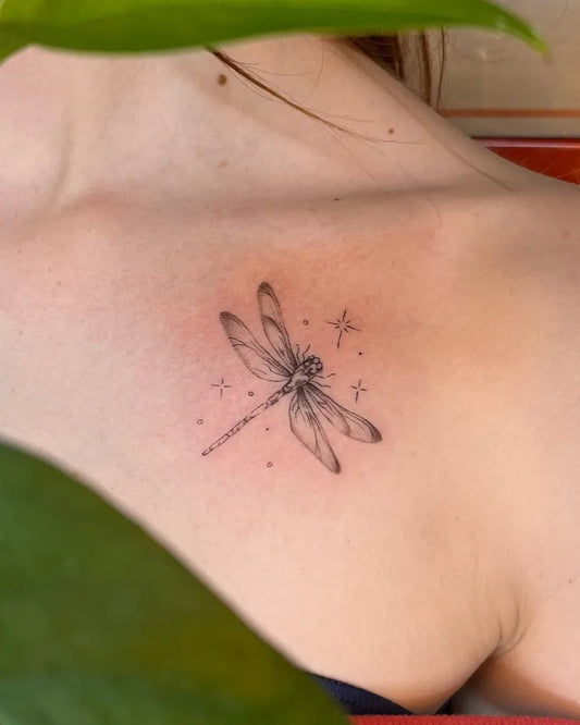 Small Fine Line Dragonfly with Stars on Women Shoulder Tattoo by @emeraldbeetattoo