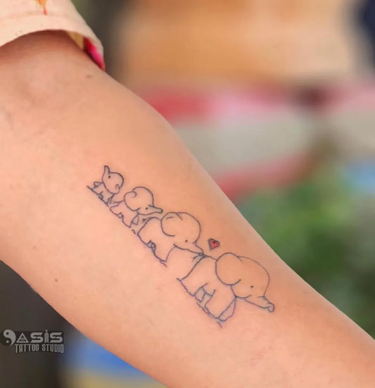 Small Fine Line Elephant Family Tattoo on Women Arm by @saranoasis