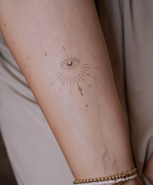 Small Fine Line Evil Eye on Women Arm Tattoo by @keyatattoo