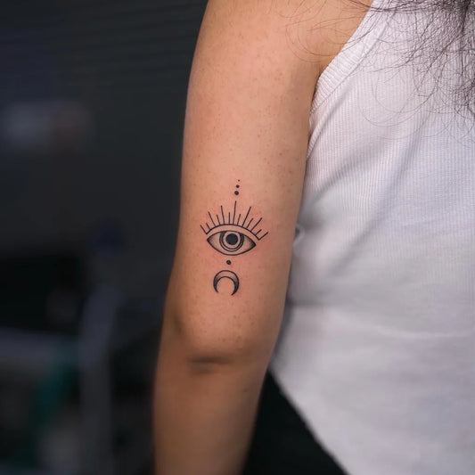 Small Fine Line Eye Moon Dots on Women Arm Tattoo by @tattoosbyrigel