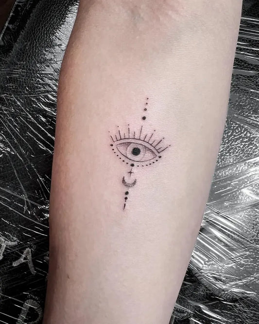 Small Fine Line Eye Moon Dots on Women Arm Tattoo by @tattoostudiomorocco