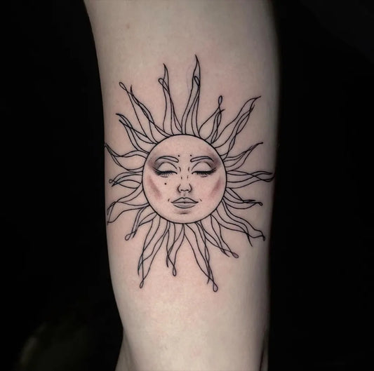 Small Fine Line Face Sun Tattoo on Women Bicep by @corinne_originals