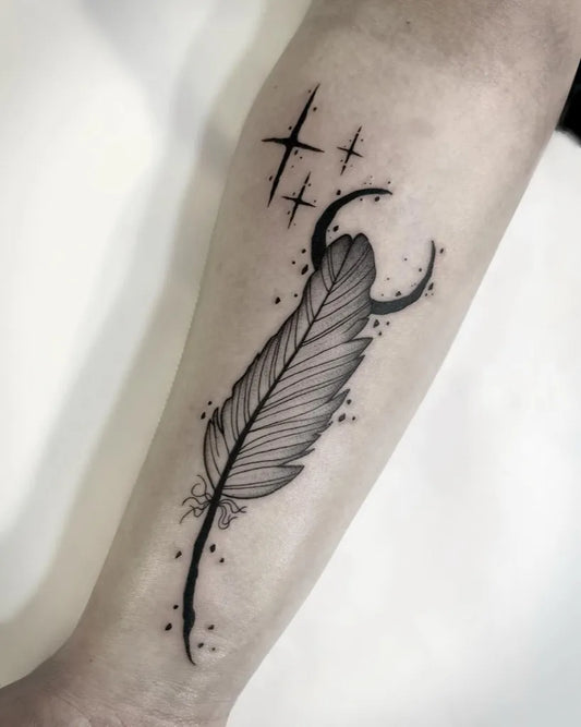 Small Fine Line Feather Crescent Moon Tattoo on Women Forearm by @zazou.ttt