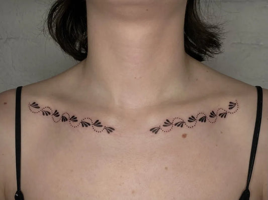 Small Fine Line Feather Designs Tattoo on Women Collarbone by @cowgurl_bebop