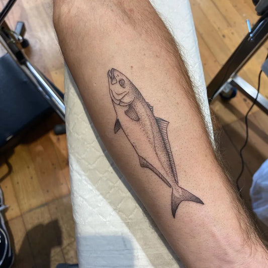 Small Fine Line Fish Tattoo on Men Arm by @ditchlifetattoos