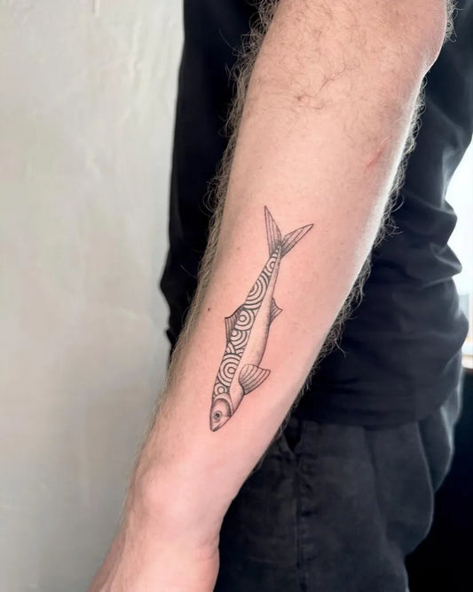 Small Fine Line Fish Tattoo on Men Arm by @ha.noir.tattoo