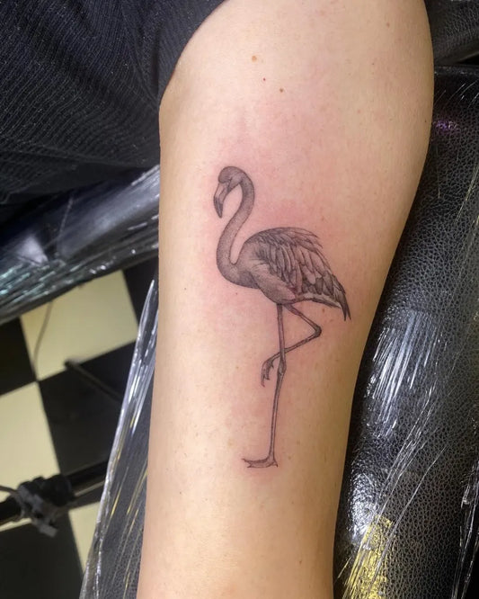 Small Fine Line Flamingo Tattoo on Women Arm by @albamartintattoo