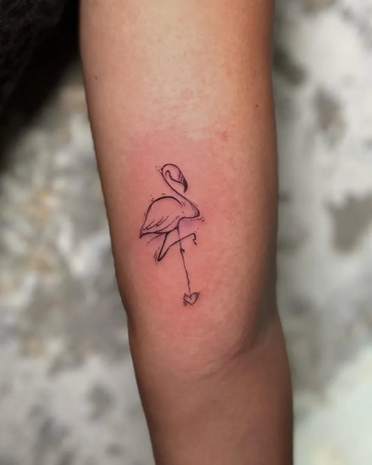Small Fine Line Flamingo Tattoo on Women Arm by @jovanjanelle.tattoo