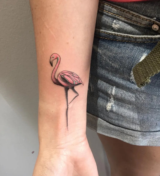 Small Fine Line Flamingo Tattoo on Women Wrist by @inkedlifemiami