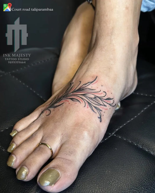 Small Fine Line Floral Branch Tattoo on Women Foot by @tattoo_ink_majesty_taliparamba