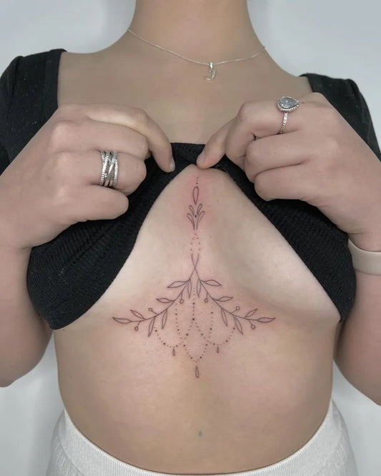 Small Fine Line Floral Mandala on Women Sternum Tattoo by @inkedbymads_