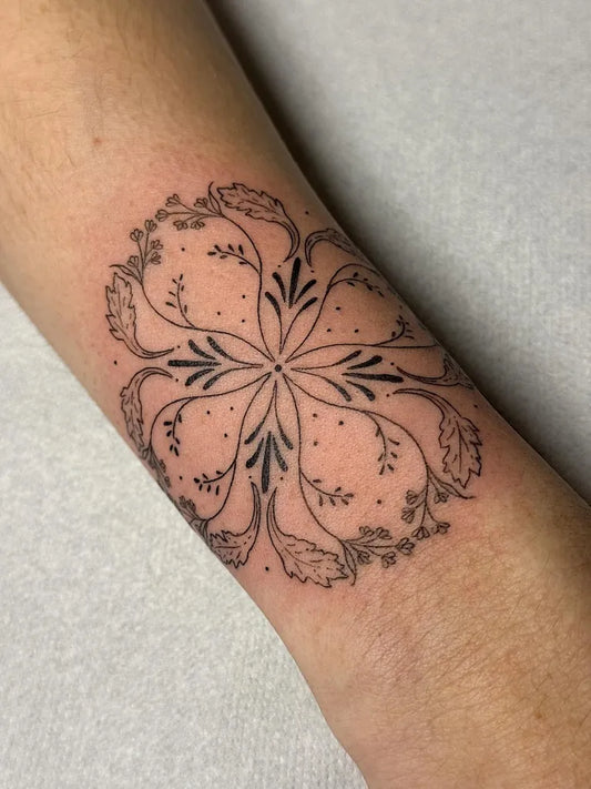 Small Fine Line Floral Mandala on Women Wrist Tattoo by @inkby.moon