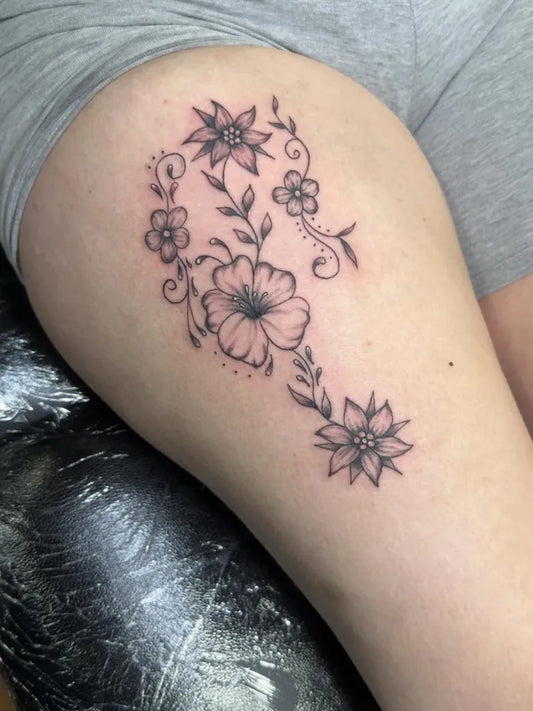 Small Fine Line Floral Vine Hibiscus on Women Thigh Flower Tattoo by @tatts_by_jay_
