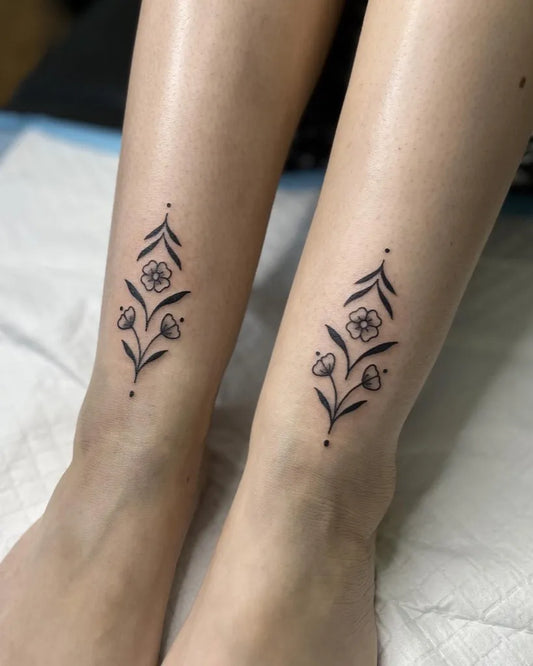Small Fine Line Floral Vine Tattoo on Women Ankle by @shanhantattoo