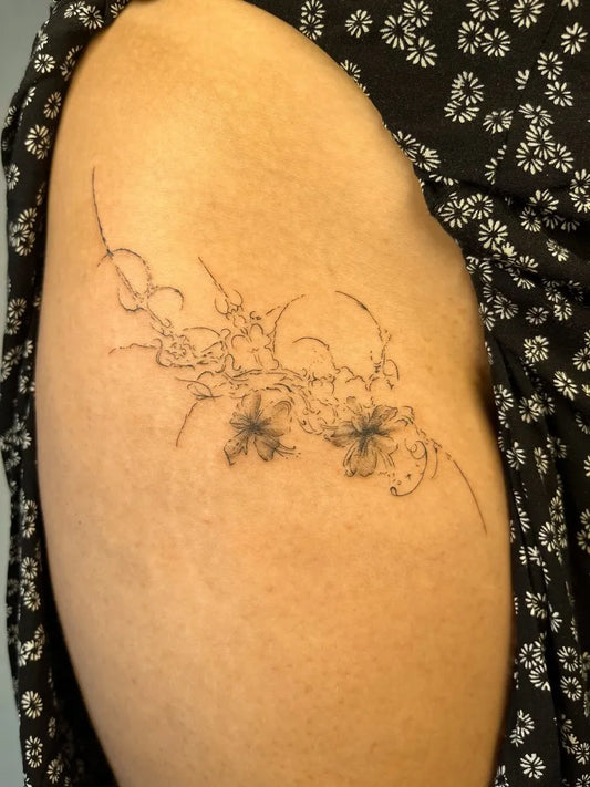 Small Fine Line Floral Vines Tattoo on Women Hip by @workkslalei