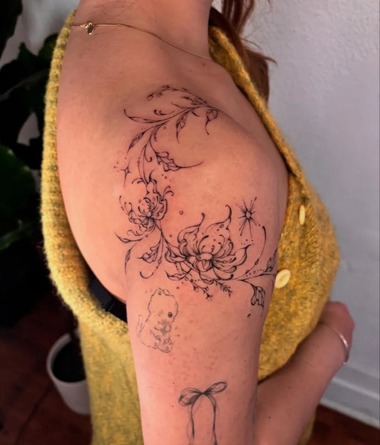 Small Fine Line Floral Vines and Baby on Women Shoulder Flower Tattoo by @qiongyu_art