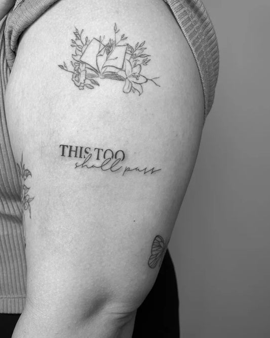 Small Fine Line Floral and Quote Tattoo on Women Bicep by @inkedbya