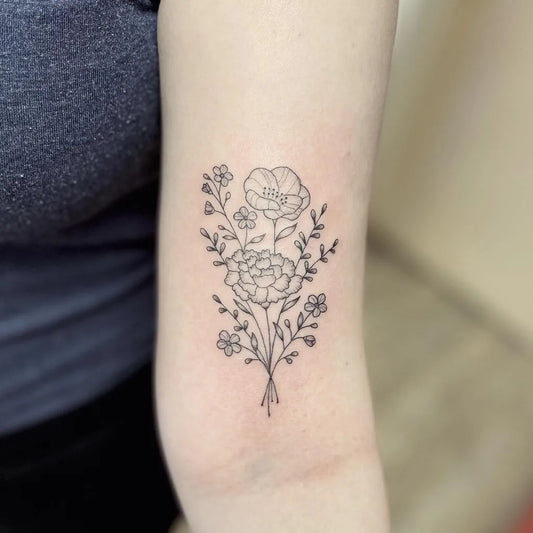 Small Fine Line Flower Bouquet Tattoo on Women Bicep by @deadbeat__steve