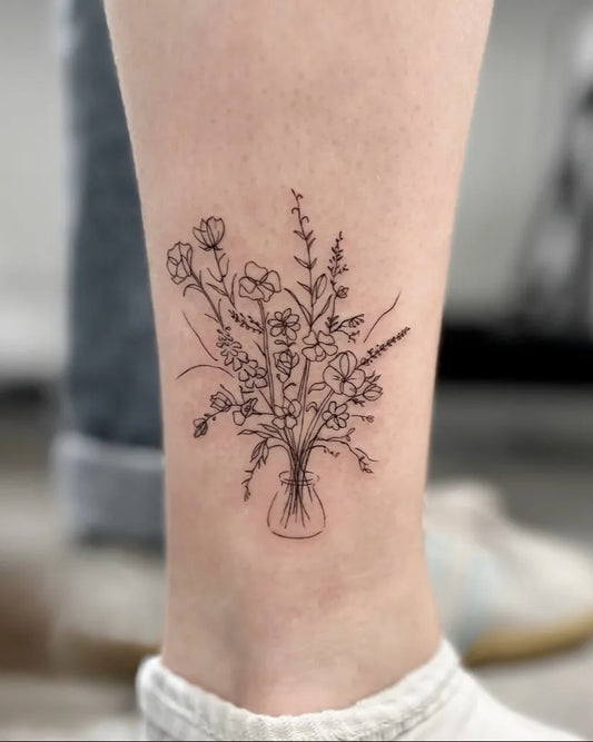 Small Fine Line Flower Bouquet in Vase Tattoo on Women Ankle by @ketch_tatt