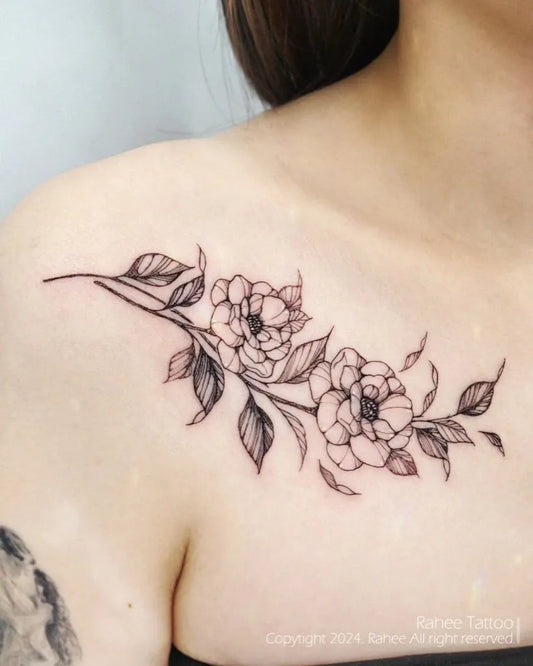Small Fine Line Flower Branch Tattoo on Women Collarbone by @rahee.tt