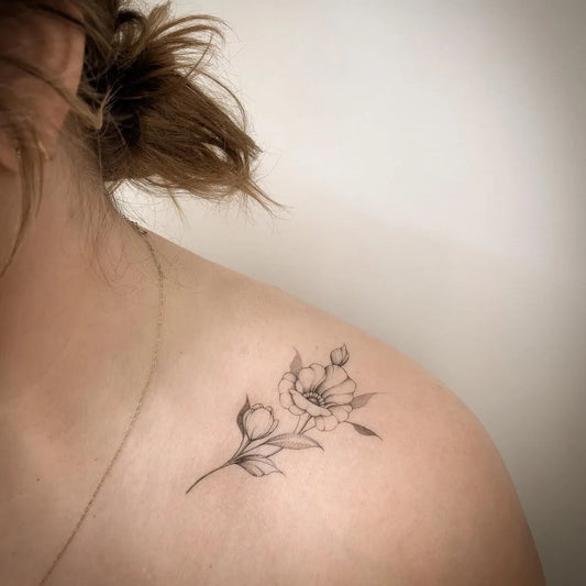 Small Fine Line Flower Buds Tattoo on Women Collarbone by @ep.created_tattoos
