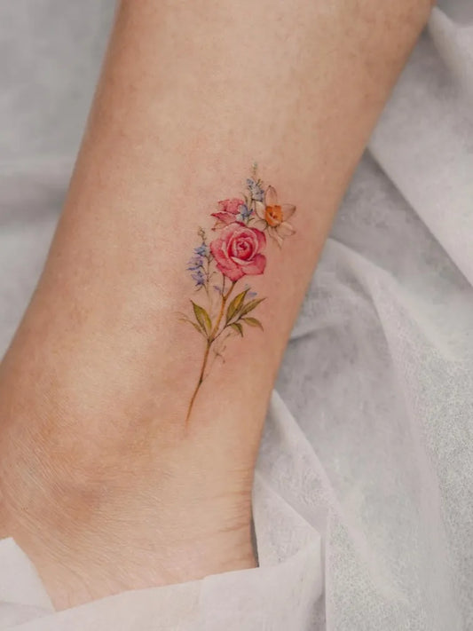 Small Fine Line Flower Daffodil Tattoo on Women Ankle by @hye.artt