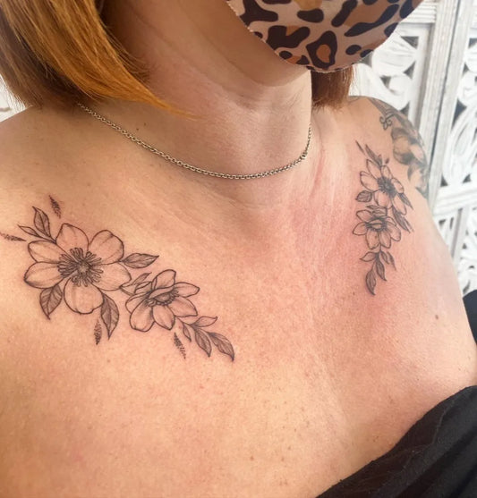Small Fine Line Flowers Tattoo on Women Collarbone by @mkirkuptattoo