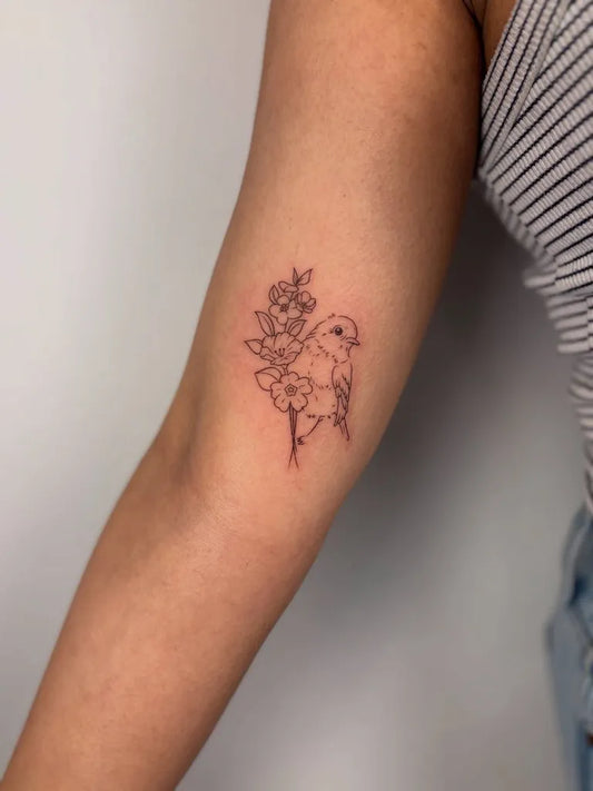 Small Fine Line Flowers and Bird on Women Arm Tattoo by @hyperink.ca