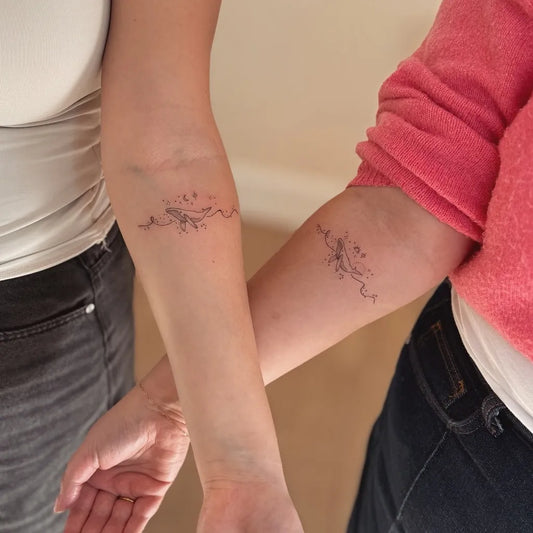 Small Fine Line Flowers and Vines on Friends on Arms Matching Tattoo by @ellierose.tattoos