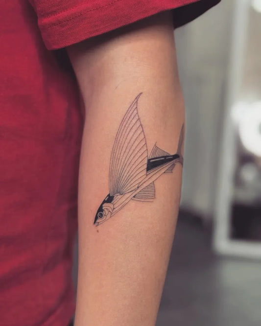 Small Fine Line Flying Fish Tattoo on Men Arm by @macun.ttt