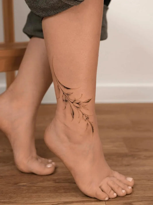 Small Fine Line Foliage on Women Ankle Tattoo by @karinamadz.tattoo