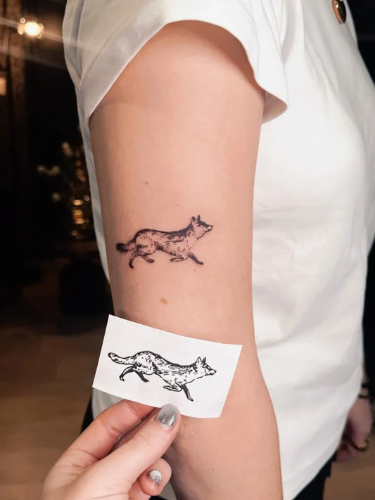 Small Fine Line Fox Tattoo on Women Arm by @elizatattooamsterdam