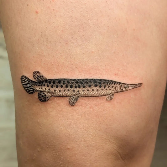 Small Fine Line Gar Fish Tattoo on Men Thigh by @elistudertattoo