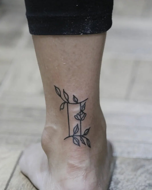 Small Fine Line Gemini Sign Tattoo on Women Ankle by @swapnils.tattoo