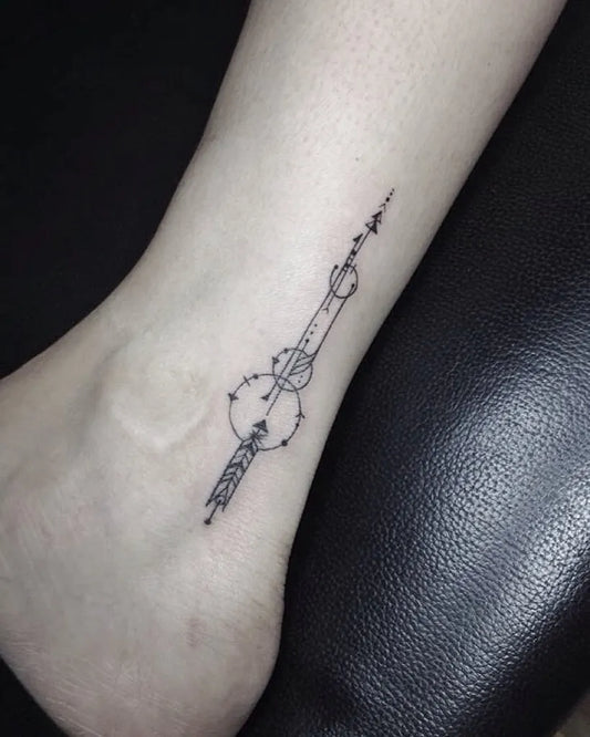 Small Fine Line Geometric Arrow Tattoo on Women Ankle by @geraldcabanesas