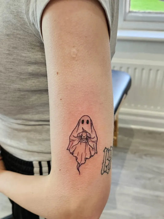 Small Fine Line Ghost Tattoo on Women Arm by @tabby.tattoos