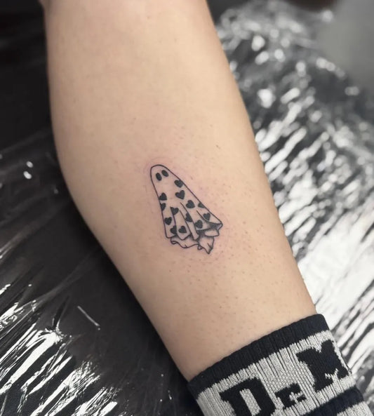 Small Fine Line Ghost wiht Hearts Tattoo on Women Arm by @micagriceart