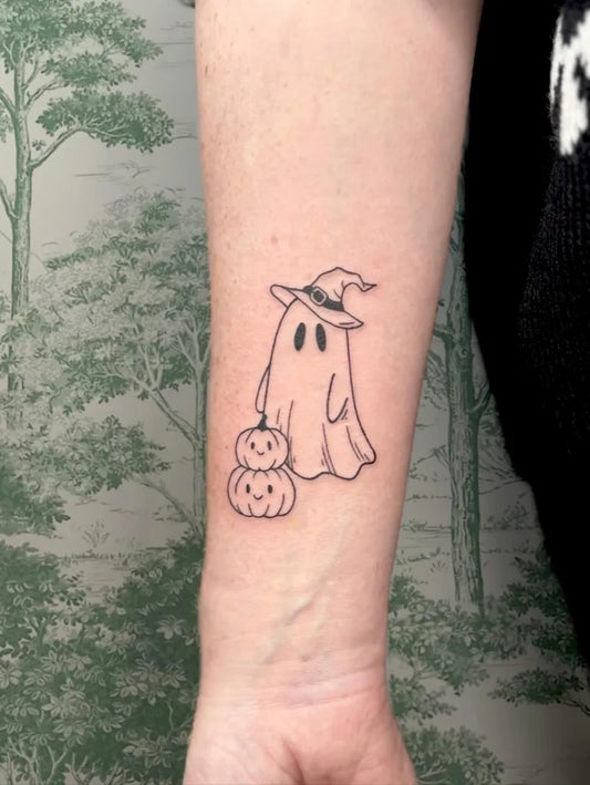 Small Fine Line Ghost with Pumpkins Tattoo on Women Wrist by @alicerosetattoo