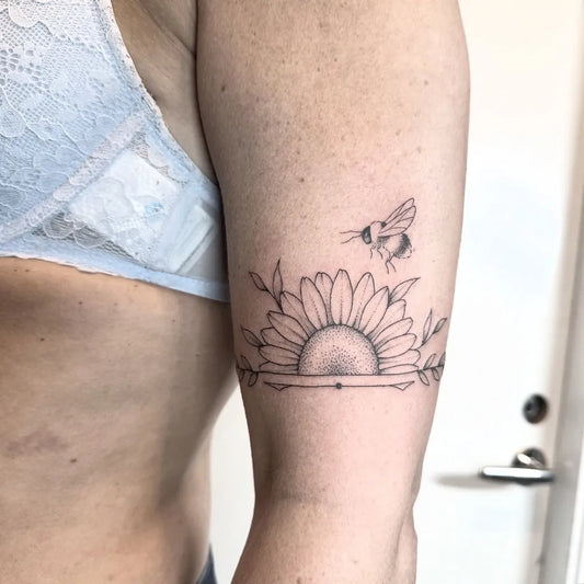 Small Fine Line Half Sunflower Bee on Women Arm Tattoo by @majaminktattoo