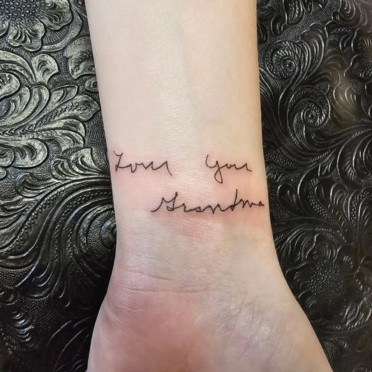 Small Fine Line Handwritten Text Quote Tattoo on Women Wrist by @kat.surber.tattoos