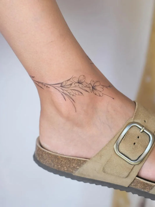 Small Fine Line Hibiscus Anklet on Women Ankle Flower Tattoo by @sevvalart.stp