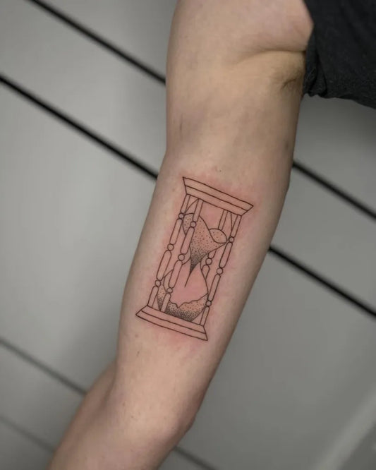 Small Fine Line Hourglass Tattoo on Women Arm by @rezichitattoos